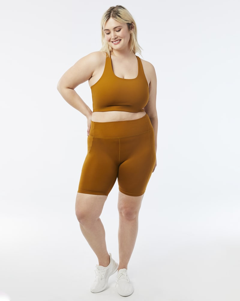 Plus size model with hourglass body shape wearing Gabi Sports Bra by Girlfriend Collective | Dia&Co | dia_product_style_image_id:157451